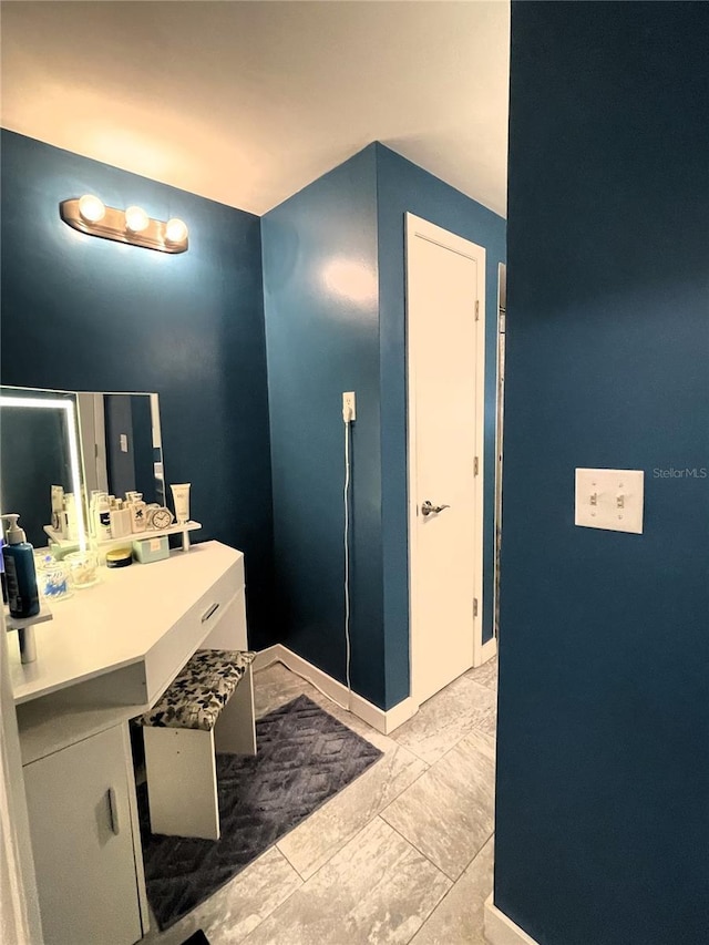 7534 Briarwood Dr, Port Richey, FL 34668 - bathroom featuring marble finish flooring and vanity