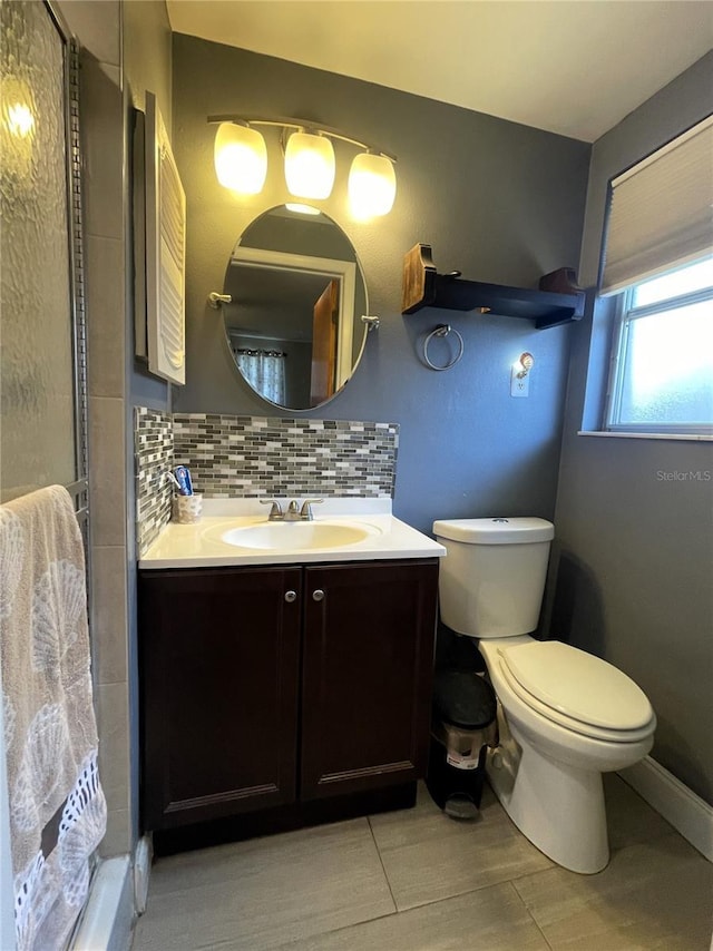 7534 Briarwood Dr, Port Richey, FL 34668 - full bath with vanity, toilet, tasteful backsplash, and a shower