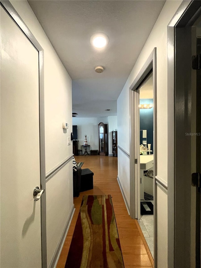 7534 Briarwood Dr, Port Richey, FL 34668 - corridor with light wood-style floors