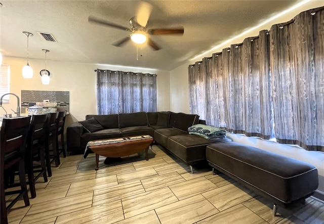 7534 Briarwood Dr, Port Richey, FL 34668 - living area featuring ceiling fan and wood tiled floors
