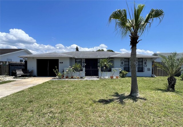 7534 Briarwood Dr, Port Richey, FL 34668 - single story home with stucco siding, concrete driveway, and a garage