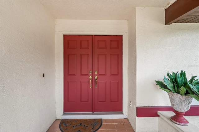 128 Oak Lake Dr, Spring Hill, FL 34608 - view of exterior entry with stucco siding