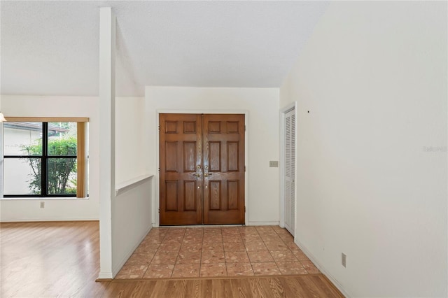 128 Oak Lake Dr, Spring Hill, FL 34608 - entrance foyer with light wood-style floors and baseboards