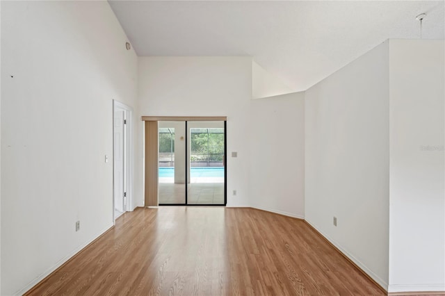 128 Oak Lake Dr, Spring Hill, FL 34608 - empty room with wood finished floors and baseboards