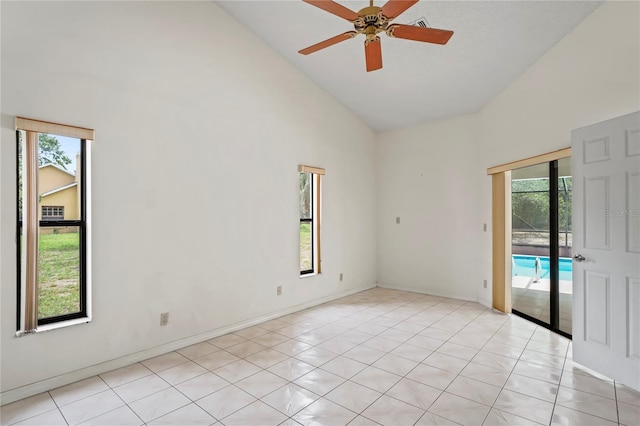 128 Oak Lake Dr, Spring Hill, FL 34608 - unfurnished room featuring high vaulted ceiling, plenty of natural light, a ceiling fan, and light tile patterned floors