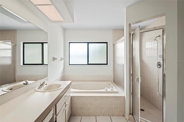 128 Oak Lake Dr, Spring Hill, FL 34608 - full bathroom with vanity, a garden tub, tile patterned floors, and a stall shower
