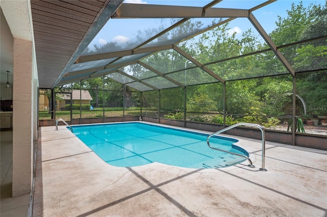 128 Oak Lake Dr, Spring Hill, FL 34608 - outdoor pool with a patio area and glass enclosure