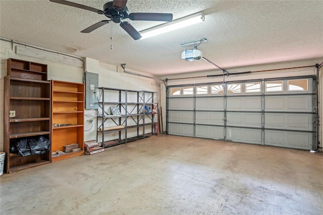 128 Oak Lake Dr, Spring Hill, FL 34608 - garage featuring electric panel, a garage door opener, and ceiling fan