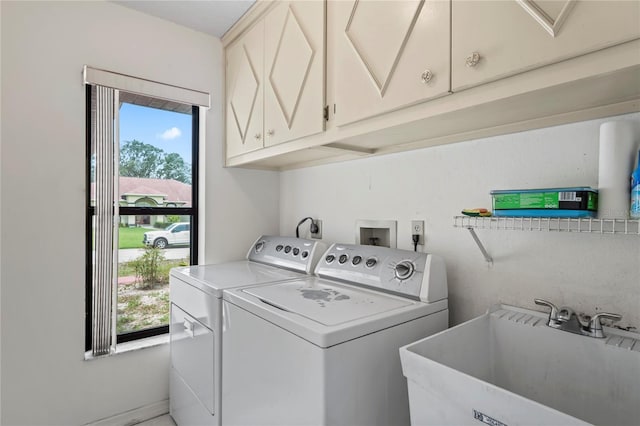128 Oak Lake Dr, Spring Hill, FL 34608 - washroom with cabinet space, independent washer and dryer, and healthy amount of natural light