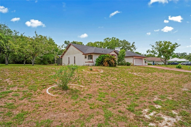 128 Oak Lake Dr, Spring Hill, FL 34608 - ranch-style home with concrete driveway, a garage, and a front yard