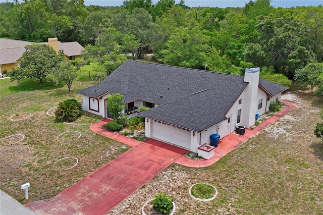 128 Oak Lake Dr, Spring Hill, FL 34608 - view of subject property with a heavily wooded area