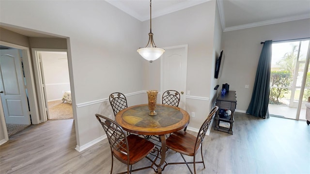 22316 Red Jacket Ln, Land O Lakes, FL 34639 - dining room with light wood-style floors, ornamental molding, and baseboards