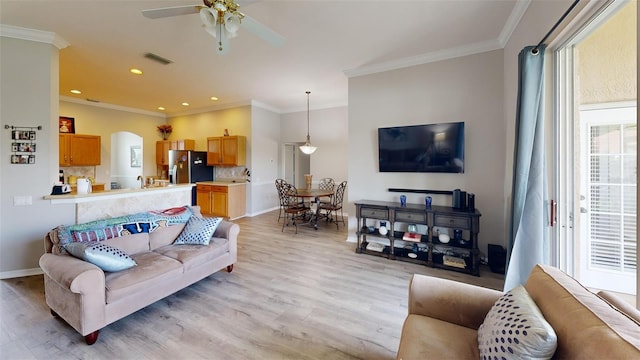 22316 Red Jacket Ln, Land O Lakes, FL 34639 - living area featuring light wood-style flooring, ceiling fan, ornamental molding, recessed lighting, and baseboards