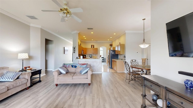 22316 Red Jacket Ln, Land O Lakes, FL 34639 - living area with crown molding, light wood-style floors, arched walkways, a ceiling fan, and recessed lighting