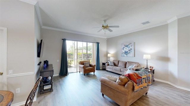 22316 Red Jacket Ln, Land O Lakes, FL 34639 - living room with wood finished floors, a ceiling fan, crown molding, and baseboards