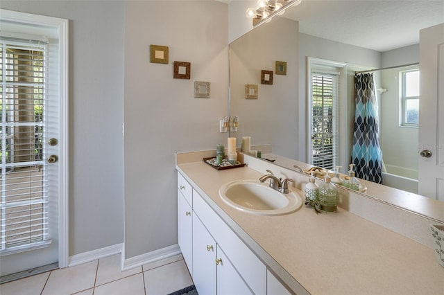 22316 Red Jacket Ln, Land O Lakes, FL 34639 - bathroom with vanity, tile patterned flooring, shower / tub combo with curtain, and baseboards