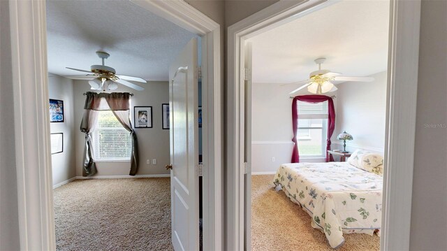 22316 Red Jacket Ln, Land O Lakes, FL 34639 - bedroom featuring light carpet, a ceiling fan, and baseboards