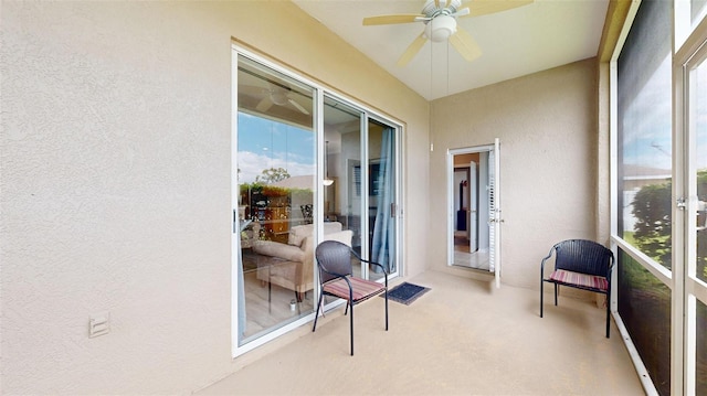 22316 Red Jacket Ln, Land O Lakes, FL 34639 - sunroom / solarium featuring a ceiling fan, a textured wall, and carpet