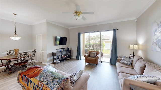 22316 Red Jacket Ln, Land O Lakes, FL 34639 - living room with crown molding, a ceiling fan, light wood-style floors, and baseboards