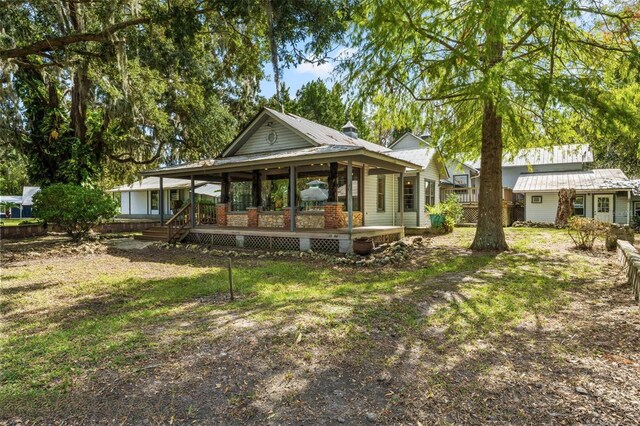 10844 W Yulee Dr, Homosassa, FL 34448 - view of grassy yard with a porch