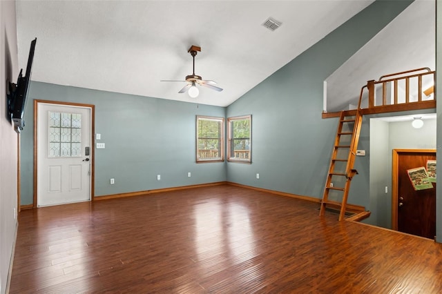 10844 W Yulee Dr, Homosassa, FL 34448 - unfurnished living room featuring plenty of natural light, lofted ceiling, a ceiling fan, and wood finished floors