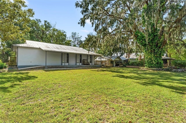10844 W Yulee Dr, Homosassa, FL 34448 - rear view of house with a yard