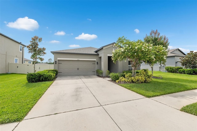 12313 Criollo Rd, Spring Hill, FL 34610 - view of front of home with stucco siding, a garage, and concrete driveway