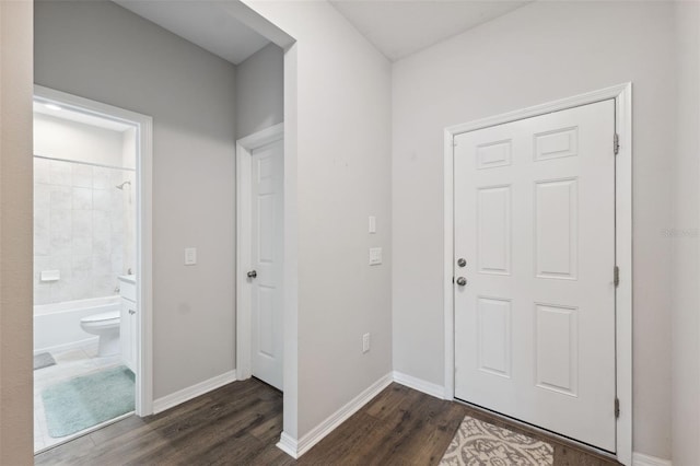 12313 Criollo Rd, Spring Hill, FL 34610 - entryway featuring dark wood-style floors and baseboards