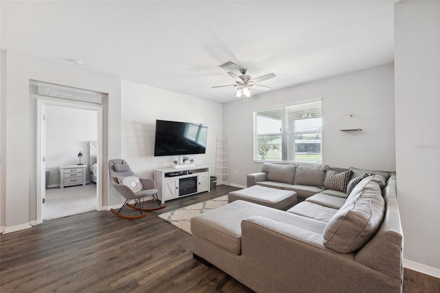 12313 Criollo Rd, Spring Hill, FL 34610 - living room featuring dark wood-style floors, baseboards, and ceiling fan