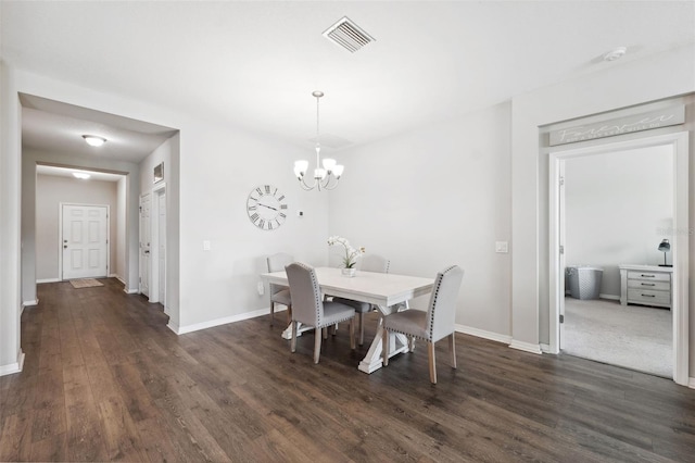 12313 Criollo Rd, Spring Hill, FL 34610 - dining space featuring dark wood-type flooring, baseboards, and a chandelier