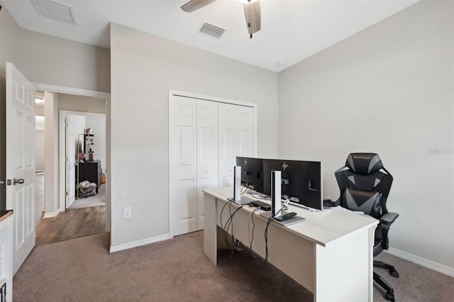 12313 Criollo Rd, Spring Hill, FL 34610 - office area featuring carpet floors, a ceiling fan, and baseboards