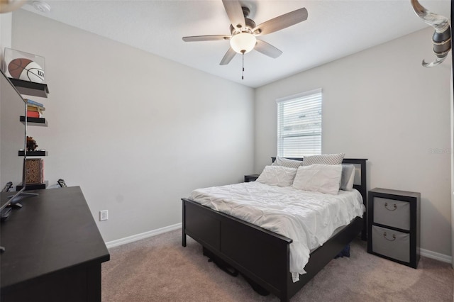 12313 Criollo Rd, Spring Hill, FL 34610 - bedroom with light colored carpet, baseboards, and a ceiling fan