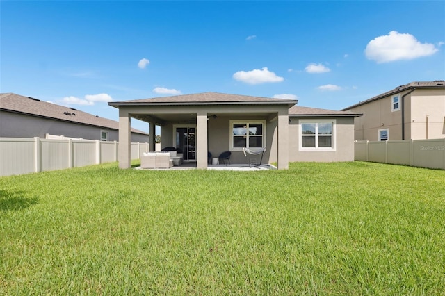 12313 Criollo Rd, Spring Hill, FL 34610 - rear view of property featuring an outdoor hangout area, stucco siding, a ceiling fan, and a patio area