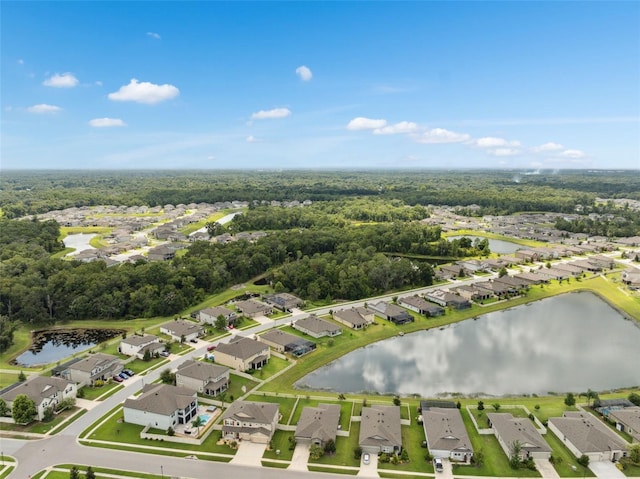 12313 Criollo Rd, Spring Hill, FL 34610 - aerial overview of property's location with nearby suburban area and a large body of water