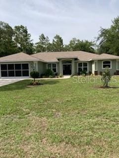 2543 E Marcia St, Inverness, FL 34453 - ranch-style home featuring a front lawn