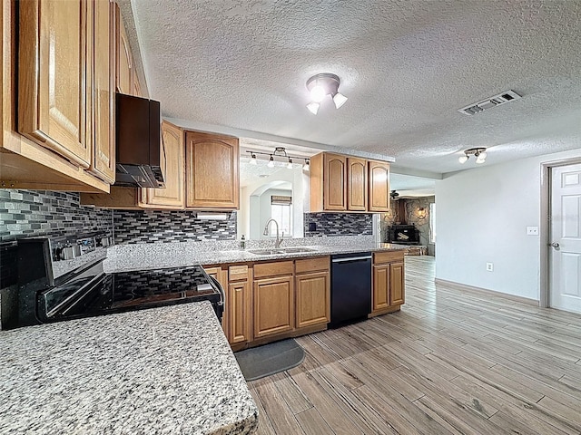 6601 Nautical Isle, Hudson, FL 34667 - kitchen featuring black dishwasher, a sink, electric range oven, tasteful backsplash, and light countertops