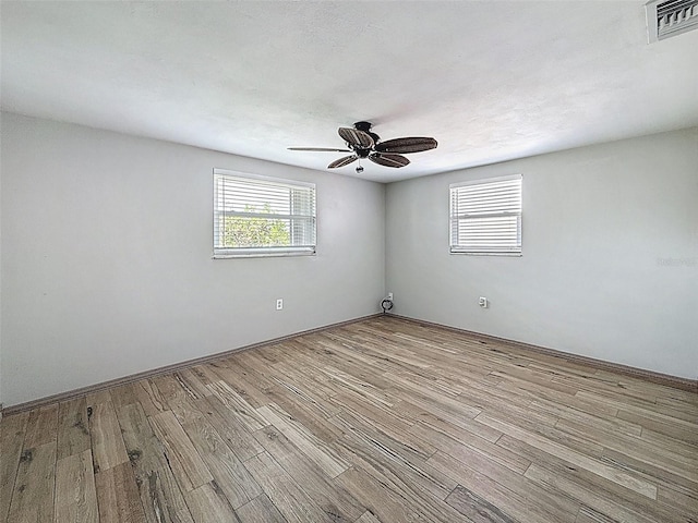 6601 Nautical Isle, Hudson, FL 34667 - unfurnished room featuring wood finished floors and a ceiling fan