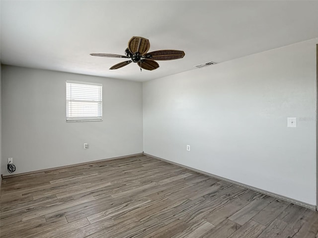 6601 Nautical Isle, Hudson, FL 34667 - empty room with wood finished floors and ceiling fan