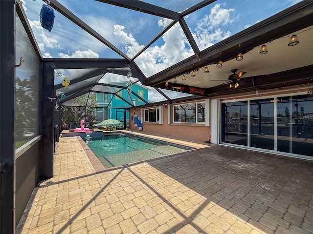 6601 Nautical Isle, Hudson, FL 34667 - outdoor pool featuring a patio area, ceiling fan, and glass enclosure