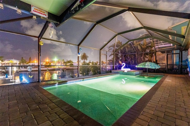 6601 Nautical Isle, Hudson, FL 34667 - swimming pool featuring a water view, glass enclosure, and a patio area