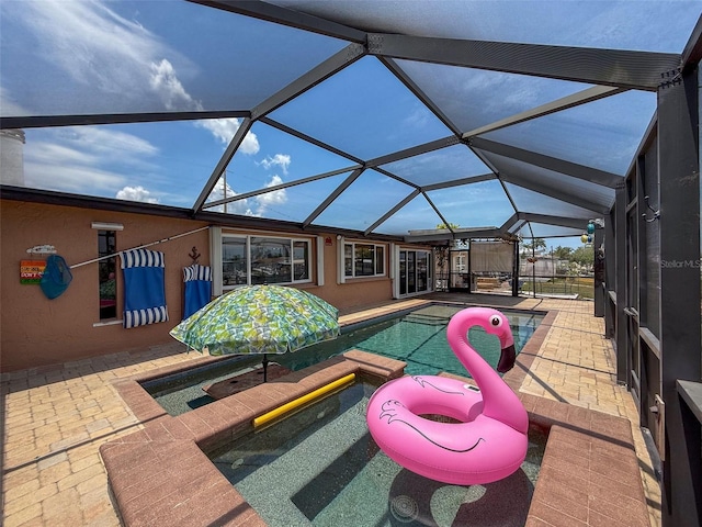 6601 Nautical Isle, Hudson, FL 34667 - swimming pool featuring a patio area and glass enclosure