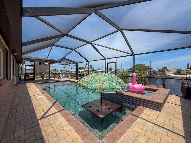 6601 Nautical Isle, Hudson, FL 34667 - outdoor pool with a patio, a lanai, and a water view