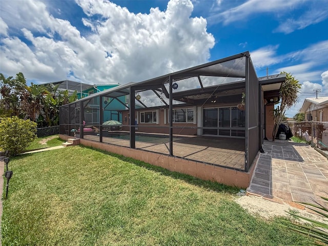 6601 Nautical Isle, Hudson, FL 34667 - back of house featuring a patio and glass enclosure