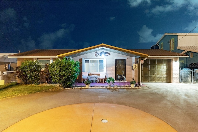 6601 Nautical Isle, Hudson, FL 34667 - view of front of house featuring concrete driveway, brick siding, and an attached garage