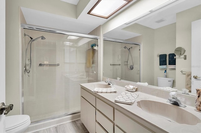 4841 Wakefield Ct Unit 4841, New Port Richey, FL 34655 - bathroom featuring toilet, double vanity, and a stall shower