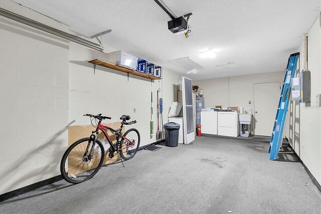 4841 Wakefield Ct Unit 4841, New Port Richey, FL 34655 - garage featuring independent washer and dryer, electric panel, a garage door opener, and baseboards