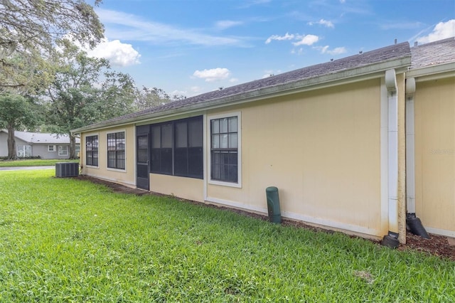 4841 Wakefield Ct Unit 4841, New Port Richey, FL 34655 - rear view of property featuring central AC and a lawn