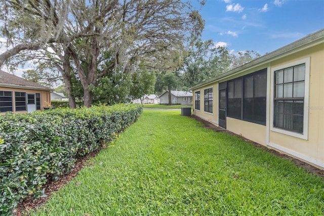 4841 Wakefield Ct Unit 4841, New Port Richey, FL 34655 - view of grassy yard with central air condition unit