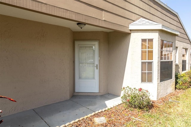 9529 Bunker Hill Ct Unit 9529, New Port Richey, FL 34655 - doorway to property with stucco siding