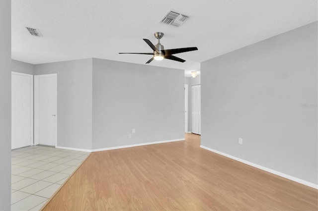 9529 Bunker Hill Ct Unit 9529, New Port Richey, FL 34655 - unfurnished room with light wood-style flooring, ceiling fan, and baseboards